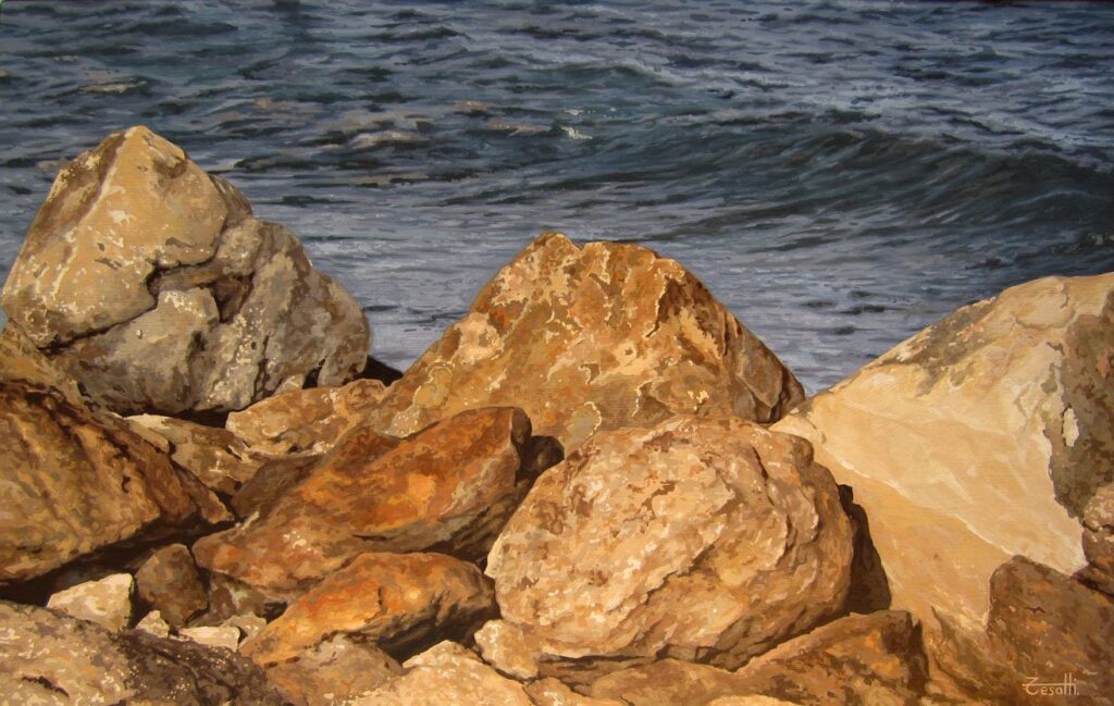 Large-scale hyperrealist acrylic painting depicting sunlit rocks by the sea with warm stone tones and moving water in the background by Armando Zesatti